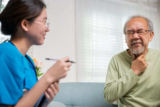 Doctor woman examines lymph nodes on elderly neck to determine if swollen, sore throat, Asian young nurse checking senior old man neck pain in clinic at retirement home, physical therapist