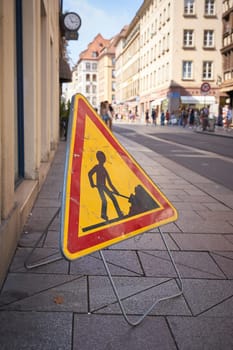 Construction site sign on a footpath in the old town of Strasbourg in France