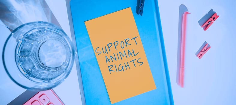Hand writing sign Support Animal Rights, Word for protection and proper treatment of all animals