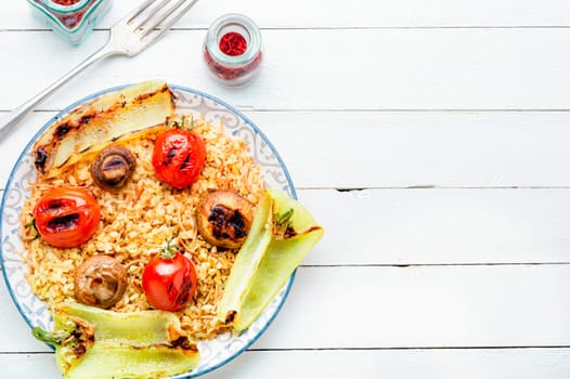 Grilled tomato, pepper and grilled mushroom lunch with rice .Top view with copy space.