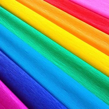 Pride Flag by Gilbert Baker. Symbol of the overall LGBTQ LGBTI community. Crepe paper is available in pink, red, orange, yellow, crepe, blue, purple and magenta. Colorful background for Pride events.