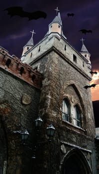mysterious view of the dark Gothic town hall with silhouettes of flying bats. Old scary castle or palace at night or in the early morning hours. Horrible Halloween. Dramatic sky with clouds.