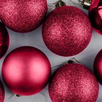 Color of the Year 2023 Viva Magenta. Trendy background of Christmas shiny balls. Fashion carmine shade. Copy space. Square