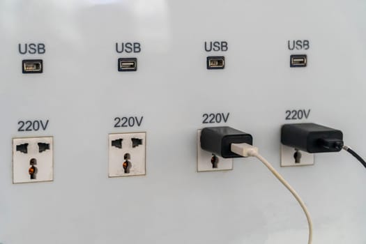 USB slot is attached to the wall for charging.