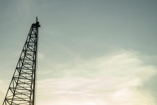 Cranes construction building in evening and evening sky