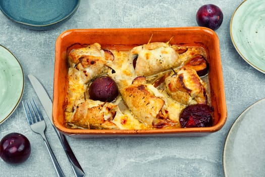 Appetizing meat rolls baked with plum filling on a plate