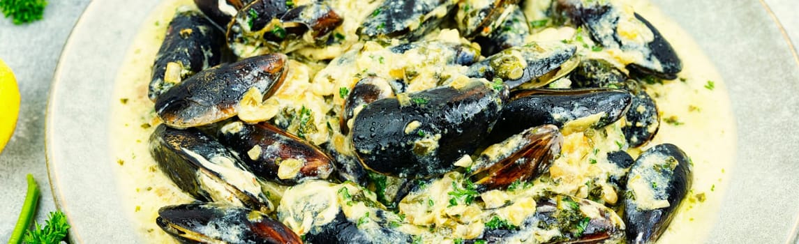 Cooked appetizing mussels in a creamy sauce
