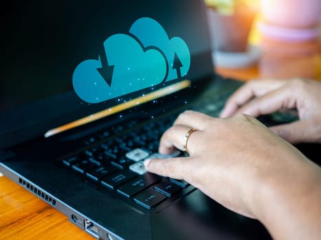 Human hand working on computer and cloud icon. Cloud computing concept, connect communication equipment  information and technology with cloud computing.