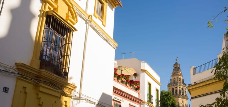 Cordoba historic quarter overview, Andalusia, Spain. Yellow Balcony with wrought iron