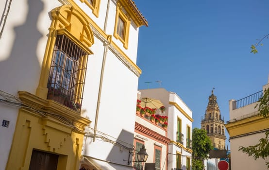 Cordoba historic quarter overview, Andalusia, Spain. Yellow Balcony with wrought iron