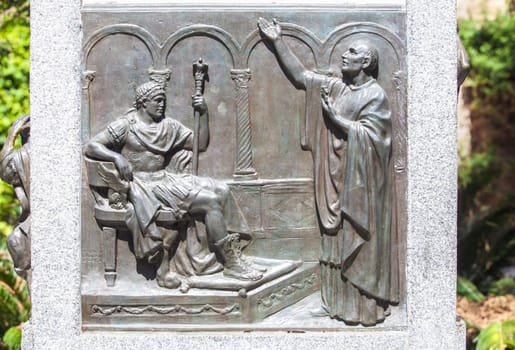 Cordoba, Spain - Sept 8th, 2020: Monument of Bishop Osio, sculptor Lorenzo Coullaut Valera, 1926. Cordoba, Spain. Biography bas-reliefs
