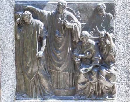 Cordoba, Spain - Sept 8th, 2020: Monument of Bishop Osio, sculptor Lorenzo Coullaut Valera, 1926. Cordoba, Spain. Biography bas-reliefs