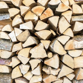 Stacked wooden logs shaping a background image.