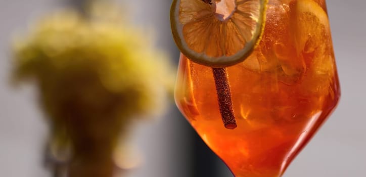 Cold and refreshing aperol spritz cocktail on table in cafe The perfect summer drink.