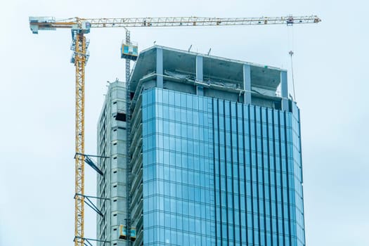 Building site with cranes and blue sky