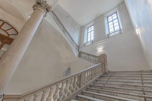TURIN, ITALY - CIRCA MAY 2021: luxury staircase made of marble in an antique Italian palace