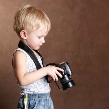 child in studio with professional camera