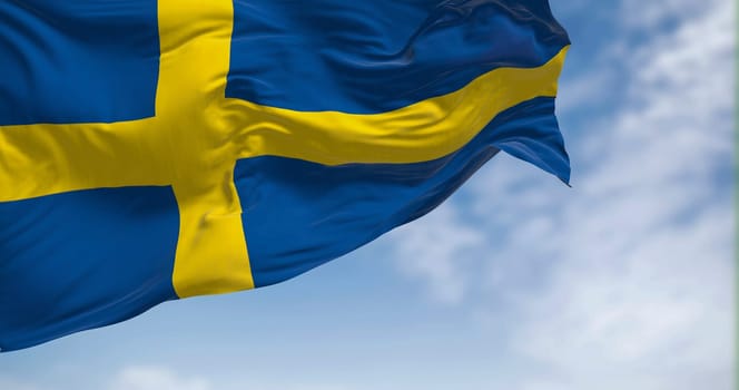 Sweden national flag waving in the wind. The Kingdom of Sweden is a Nordic country in Scandinavia. Selective focus. 3d illustration