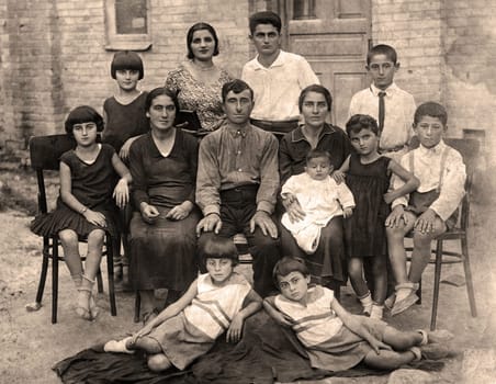 Family portrait, people of all ages, circa 1930.
