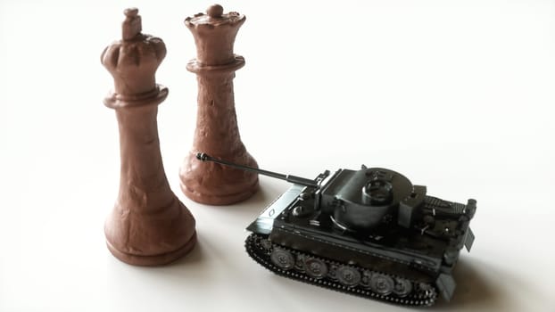 Toy tanks with chess on chessboard. Concept of military strategy. -- 3D Rendering
