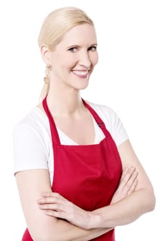 Confident female chef posing with arms crossed