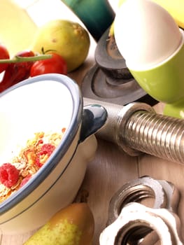 Healthy breakfast with fitness equipment on a wooden table