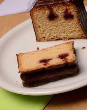 Sweet cherry cake on a white plate
