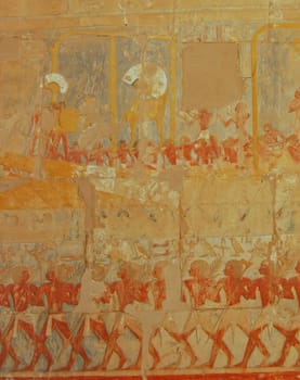 Egyptian soldiers and boat sailing relief on wall in Hatshepsut temple, Egypt