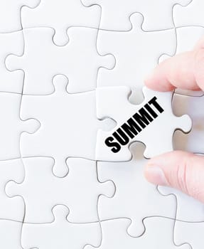 Last puzzle piece with word SUMMIT. Concept image