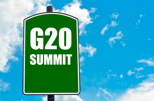 G20 SUMMIT written on green road sign  against clear blue sky background. Concept image with available copy space