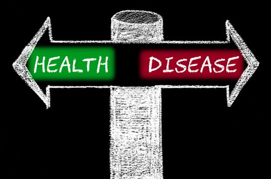 Opposite arrows with Health versus Disease. Hand drawing with chalk on blackboard. Choice conceptual image