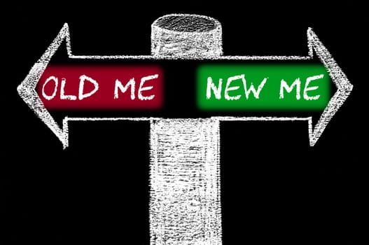 Opposite arrows with Old Me versus New Me. Hand drawing with chalk on blackboard. Choice conceptual image
