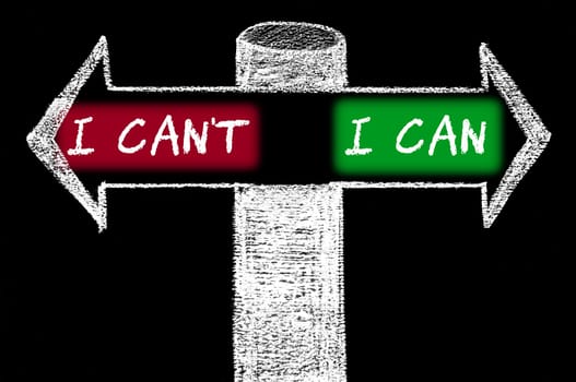 Opposite arrows with I Can't versus I Can. Hand drawing with chalk on blackboard. Choice conceptual image