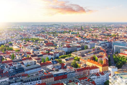 Sunset panorama of Berlin, colorful roofs of the city, Germany.