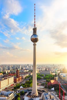 skyline panorama of Berlin with Red City Hall and TV Tower at sunset, Germany.