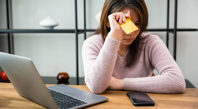 Stressed female hold credit card calculating monthly home expenses income is money not enough with laptop computer, Worried woman have problem with blocked creditcard rejected online payment
