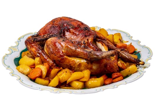 Grilled whole guinea fowl or baked pearl chicken on roasted potatoes and vegetables and port wine sauce is served on a beautiful plate. Clipping path. Isolated on white.