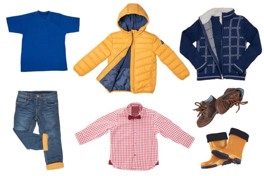 Collage set of little boys autumn clothes isolated on a white background. Denim trousers or pants, sneaker, a down jacket, shirts and boots for child boy. Children's winter fashion.