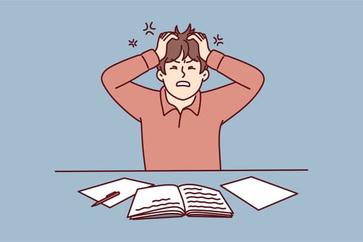Angry man clutching head sitting at table with workbooks suffering from nervous work or impossible deadlines. Young guy student chafe after made mistake during learning. Flat vector illustration