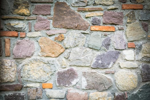 Old brick wall, old texture of withe and red stone blocks closeup