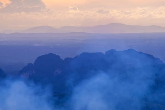 View of landscape nature and mist and mountain with sunlight and sunset or sunrise in morning light, Abstract and pattern of cloud sky Calming coral, Orange, Trend color of the year background