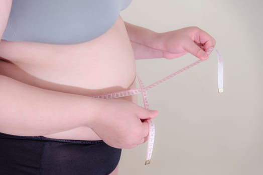 Fat woman, Shape up healthy stomach muscle, and diet lifestyle, to reduce belly concept.