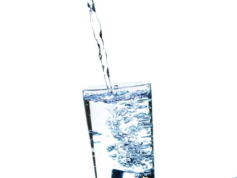 The image of pouring drinking water, into a glass, that makes one feel refreshed on blurred white background, Splashing water, Sparkling water