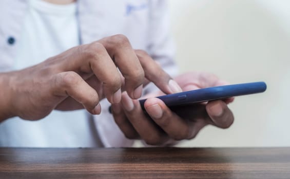 Business man using smartphone mobile blurred background, Age of technology People's, Use of technology in the modern era, Interconnection by internet network, Communication with the Internet
