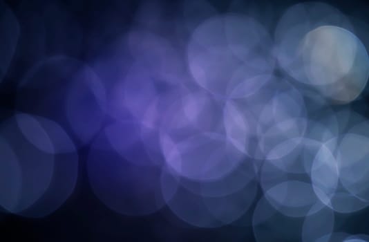 Light abstract dark bokeh christmas circle color glitter blurred black background