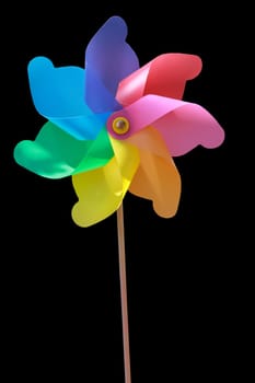 A plastic windmill with a wooden handle. Not a toy for children.