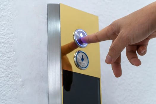 Hand push the elevator button up