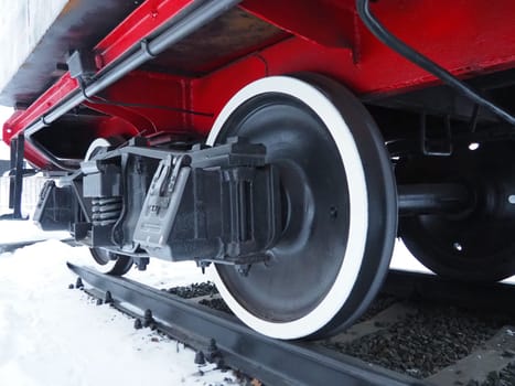 retro train. Locomotive of the 19th early 20th century with a steam engine. Vintage style. Black train with red wheels. Metal cast iron parts.