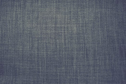 gray background fabric texture. A piece of woolen cloth is neatly laid out on the surface. Weave and textile texture. Dress fabric or for kitchen needs, tablecloth or curtains, close-up. Dash.