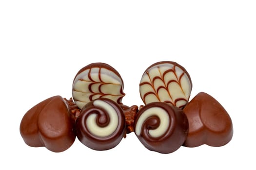 Chocolate candies collection. Beautifully assortment of various chocolate candies sweets isolated of a white background. Clipping path. Macro.
